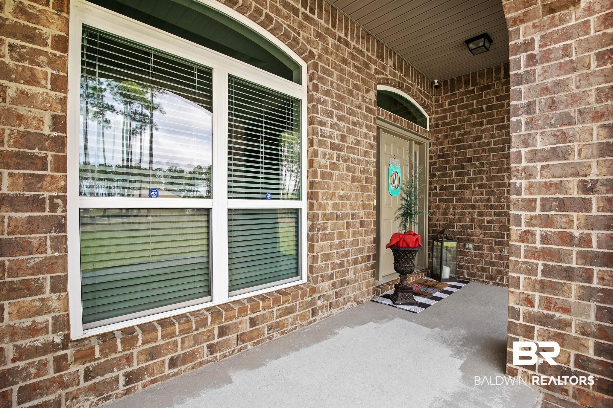 12750 B Jenkins Pit Road Daphne, AL 36527 - Photo 6 of 89 Entrance to property with brick siding and covered porch