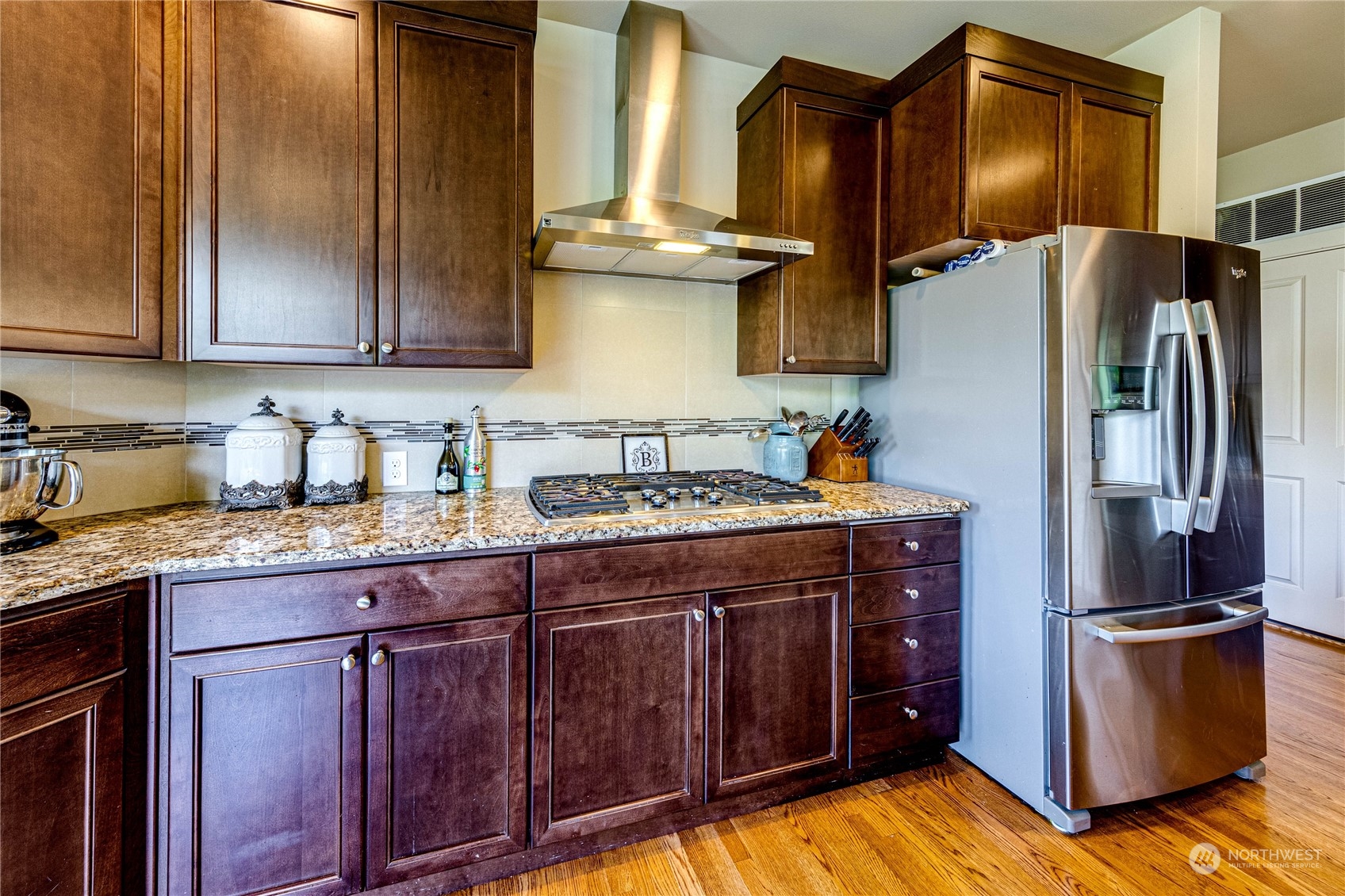 4315 229th Place Southeast Bothell, WA 98021 - Photo 15 of 40 a kitchen with stainless steel appliances granite countertop a refrigerator a stove and a sink