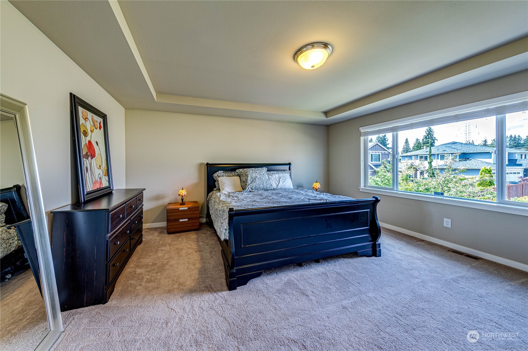 4315 229th Place Southeast Bothell, WA 98021 - Photo 24 of 40 a bedroom with furniture and a flat screen tv