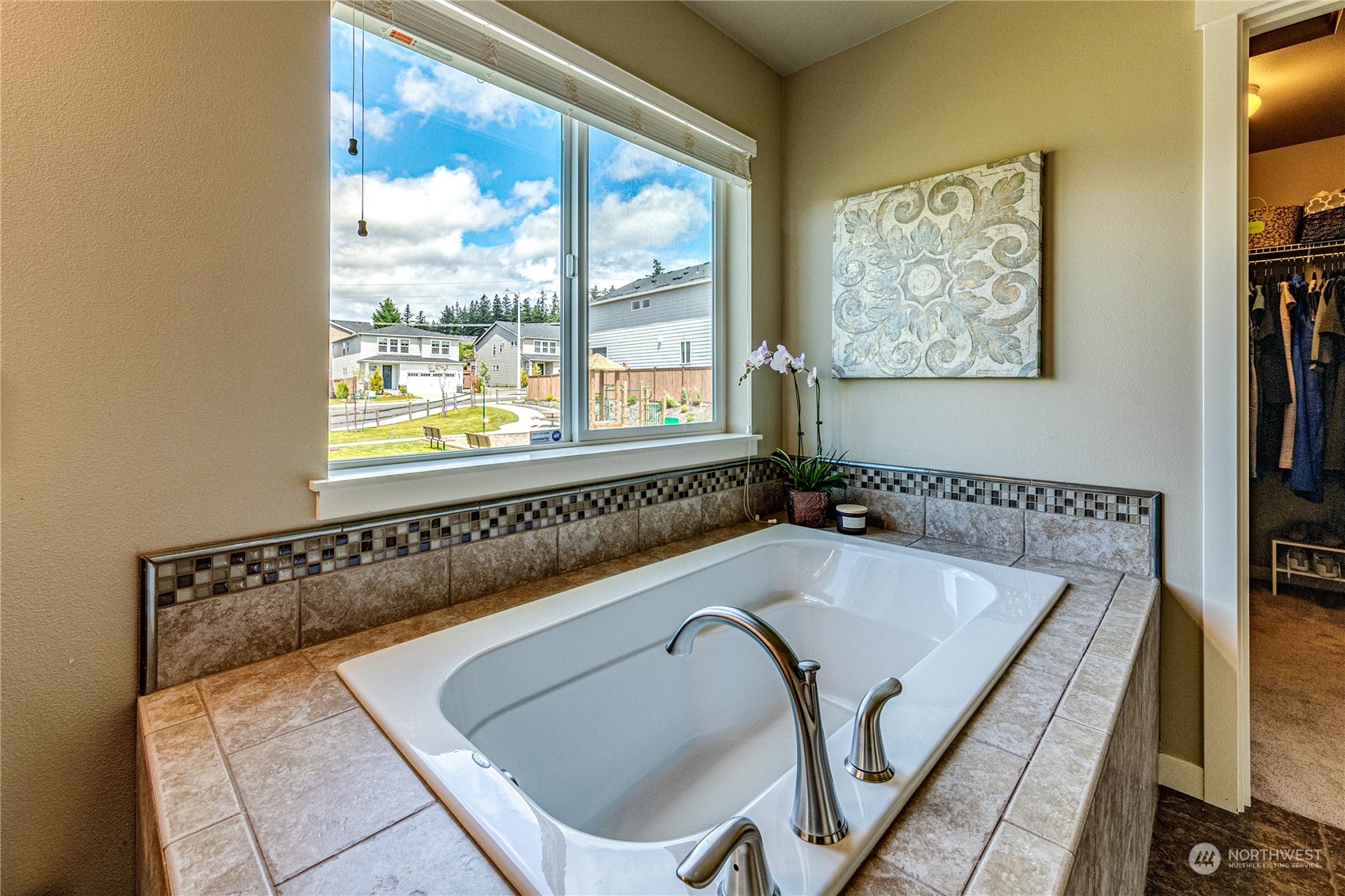 4315 229th Place Southeast Bothell, WA 98021 - Photo 28 of 40 a bathroom with a tub and a large window