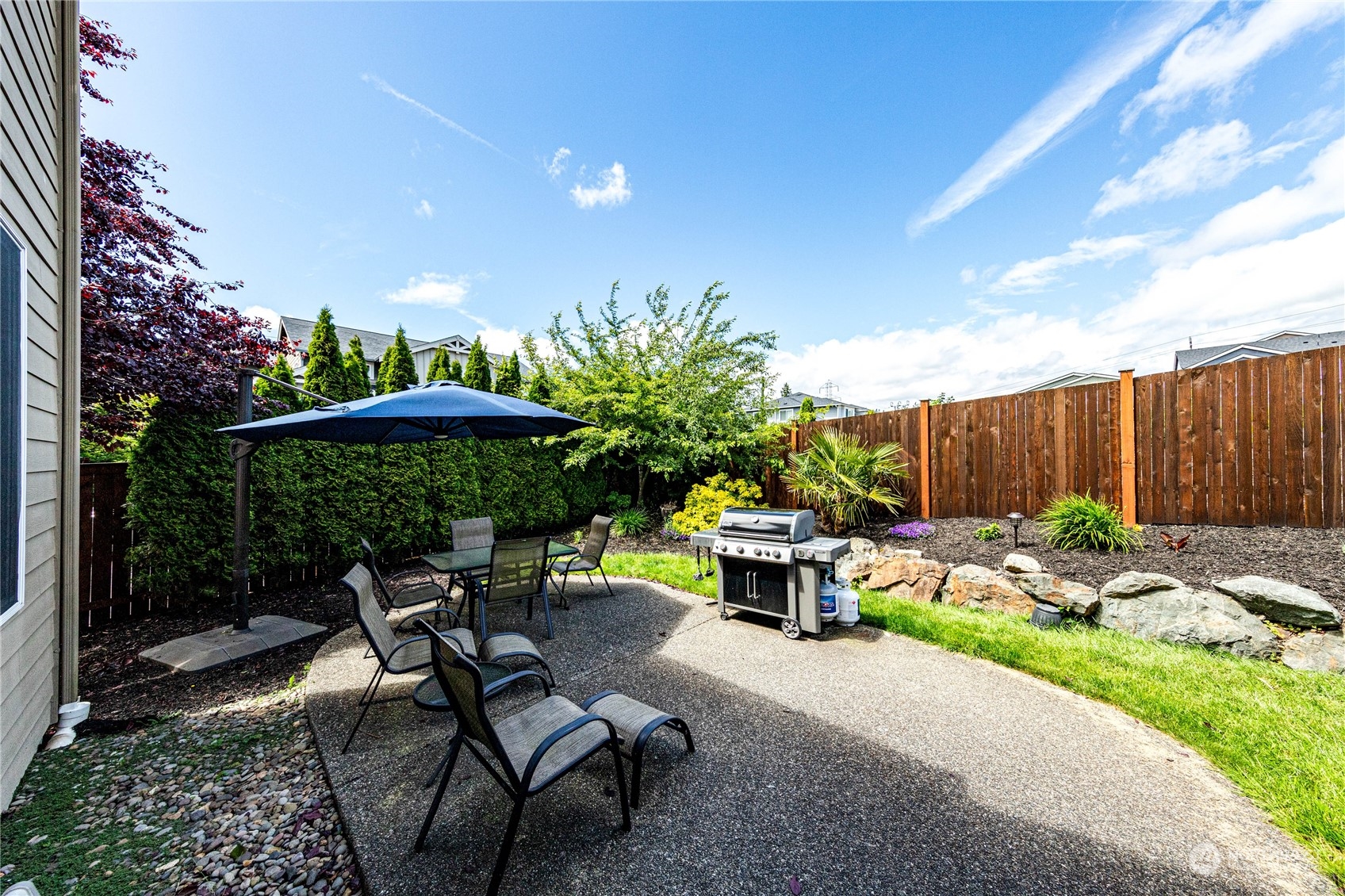 4315 229th Place Southeast Bothell, WA 98021 - Photo 36 of 40 a backyard of a house with yard barbeque oven and outdoor seating
