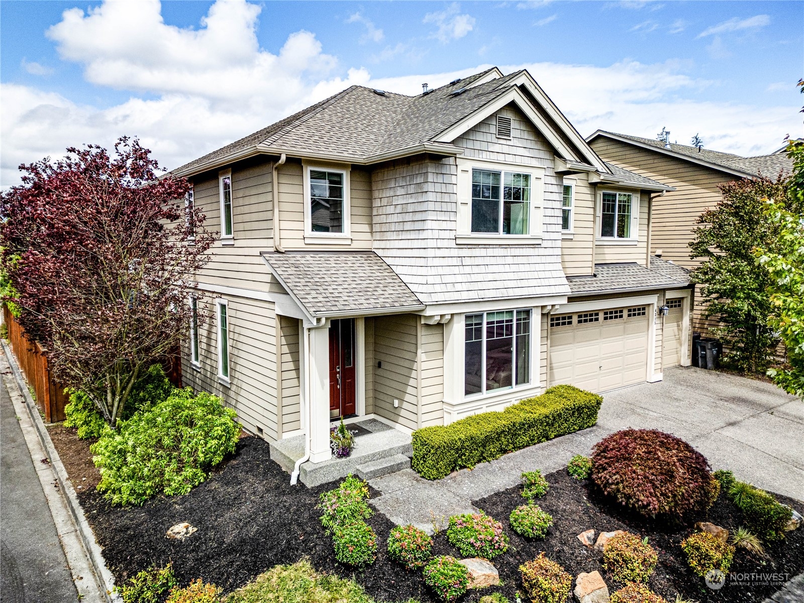 4315 229th Place Southeast Bothell, WA 98021 - Photo 40 of 40 a front view of a house with a garden