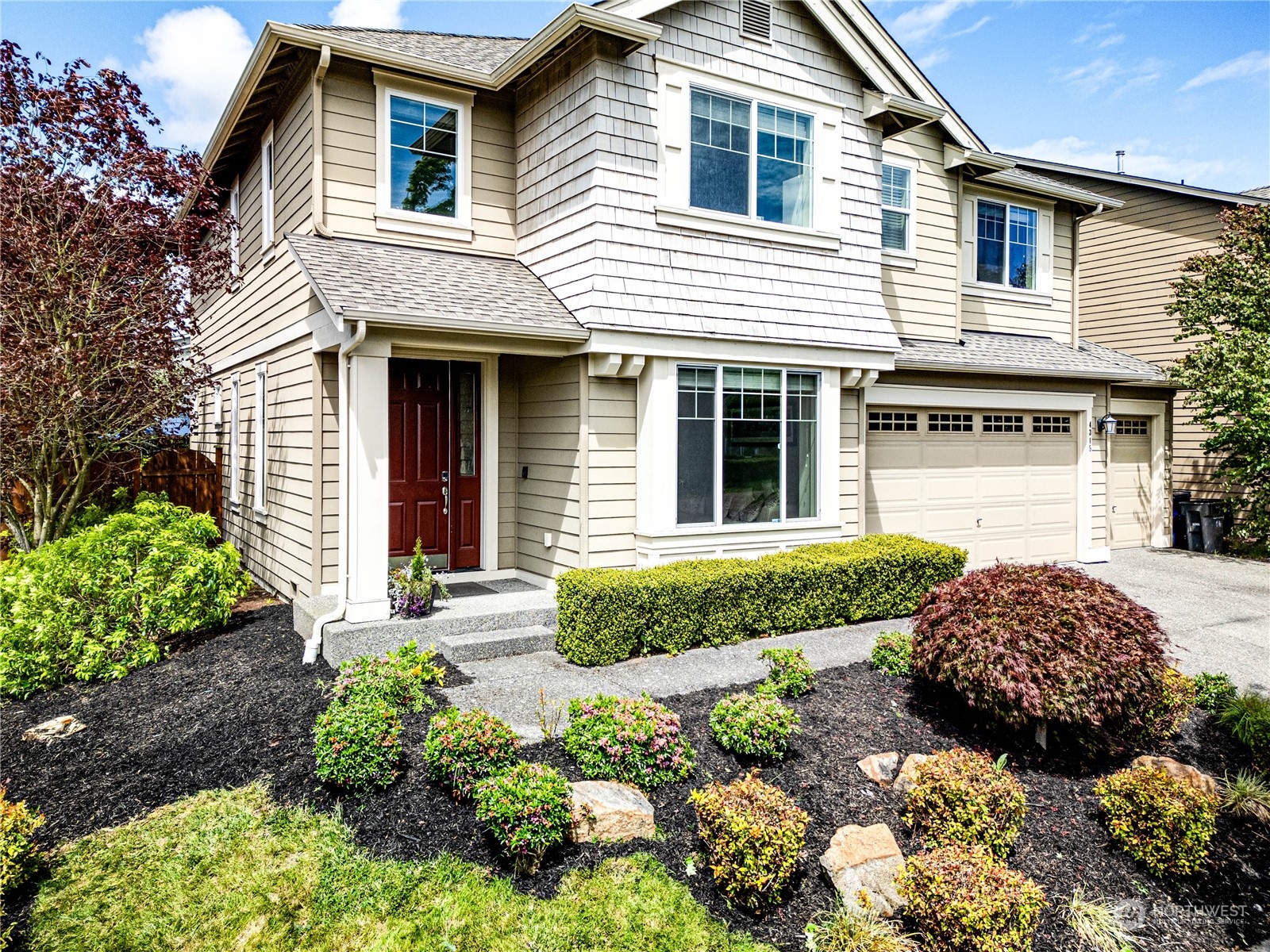 4315 229th Place Southeast Bothell, WA 98021 - Photo 4 of 40 a front view of a house with garden