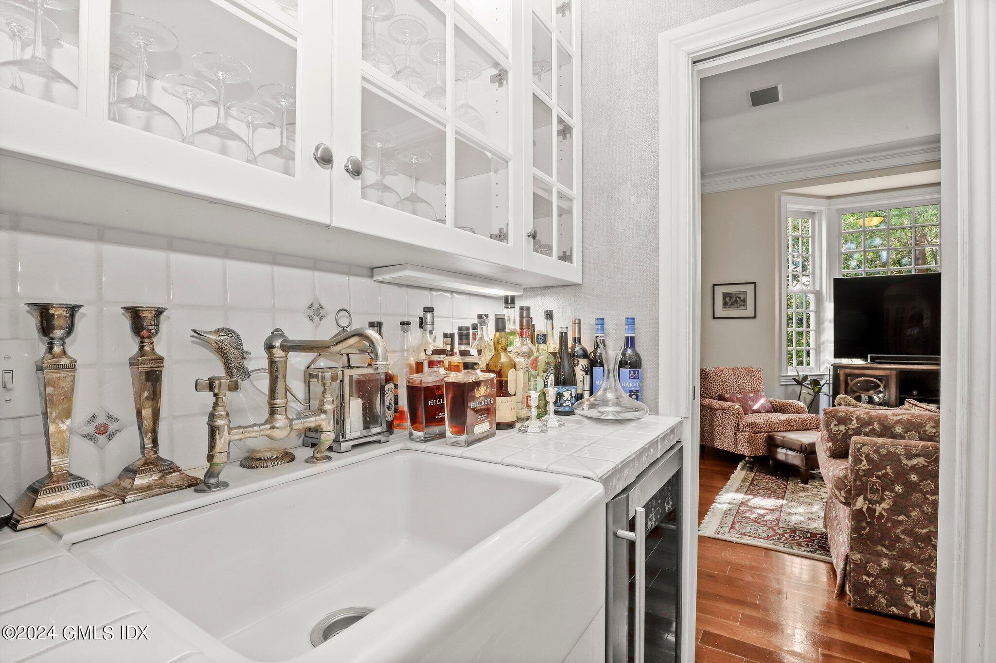 25 Field Road Riverside, CT 06878 - Photo 15 of 34 a view of a living room with furniture and a flat screen tv