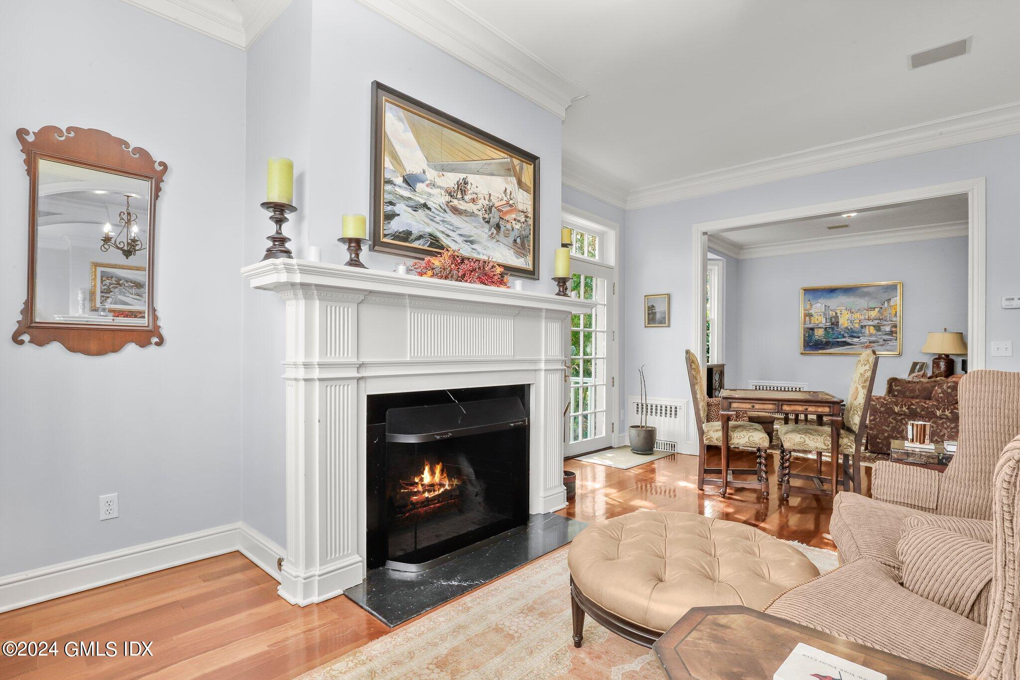 25 Field Road Riverside, CT 06878 - Photo 17 of 34 a living room with furniture and a fireplace