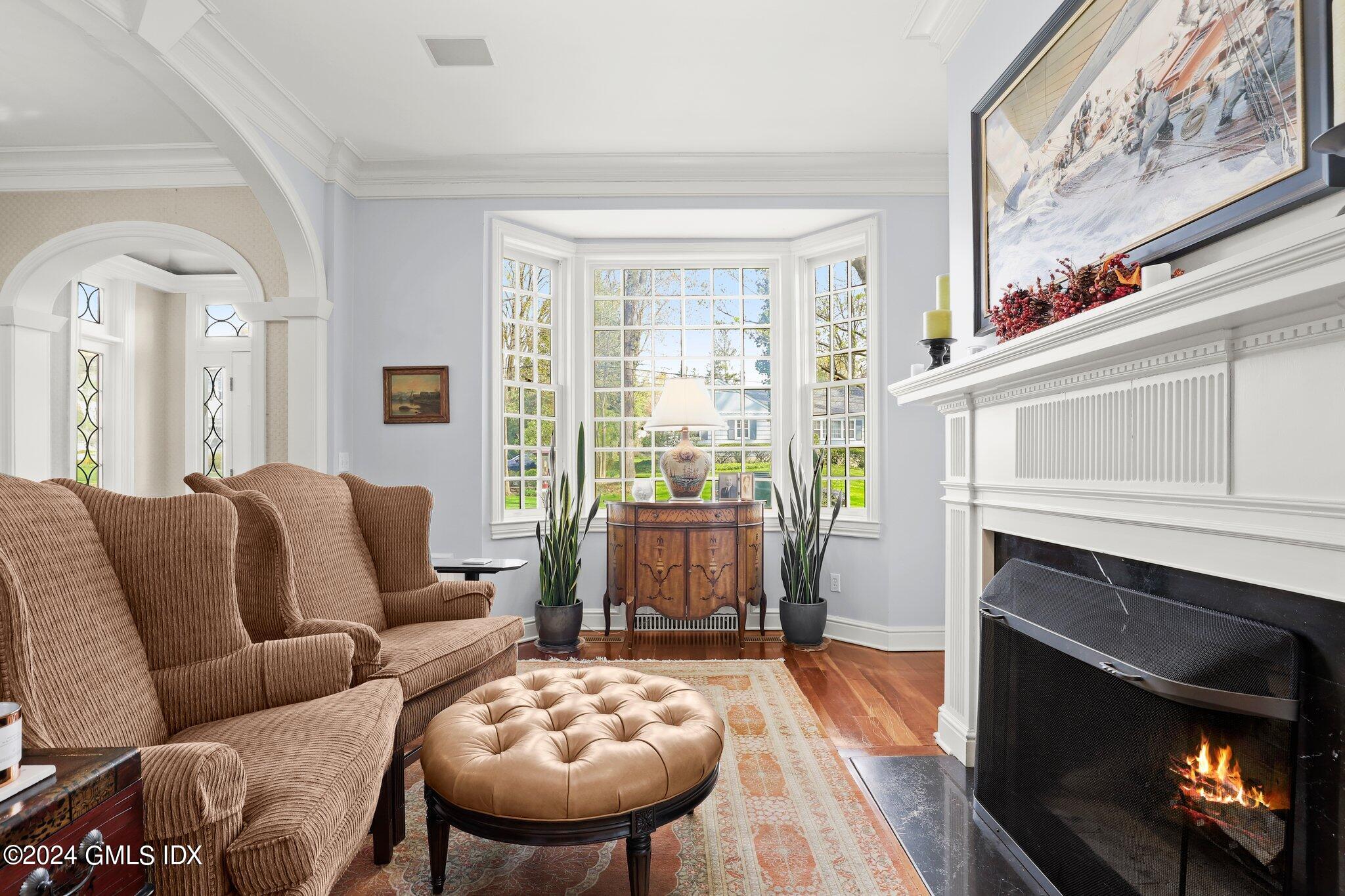 25 Field Road Riverside, CT 06878 - Photo 19 of 34 a living room with furniture and a fireplace