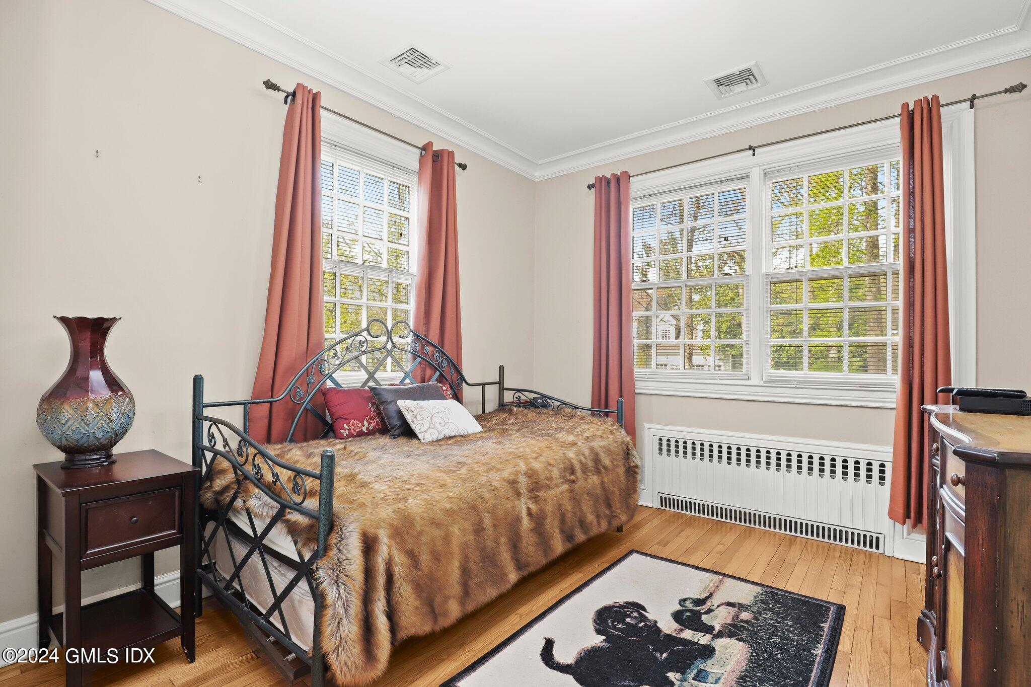 25 Field Road Riverside, CT 06878 - Photo 25 of 34 a bedroom with a bed and a window