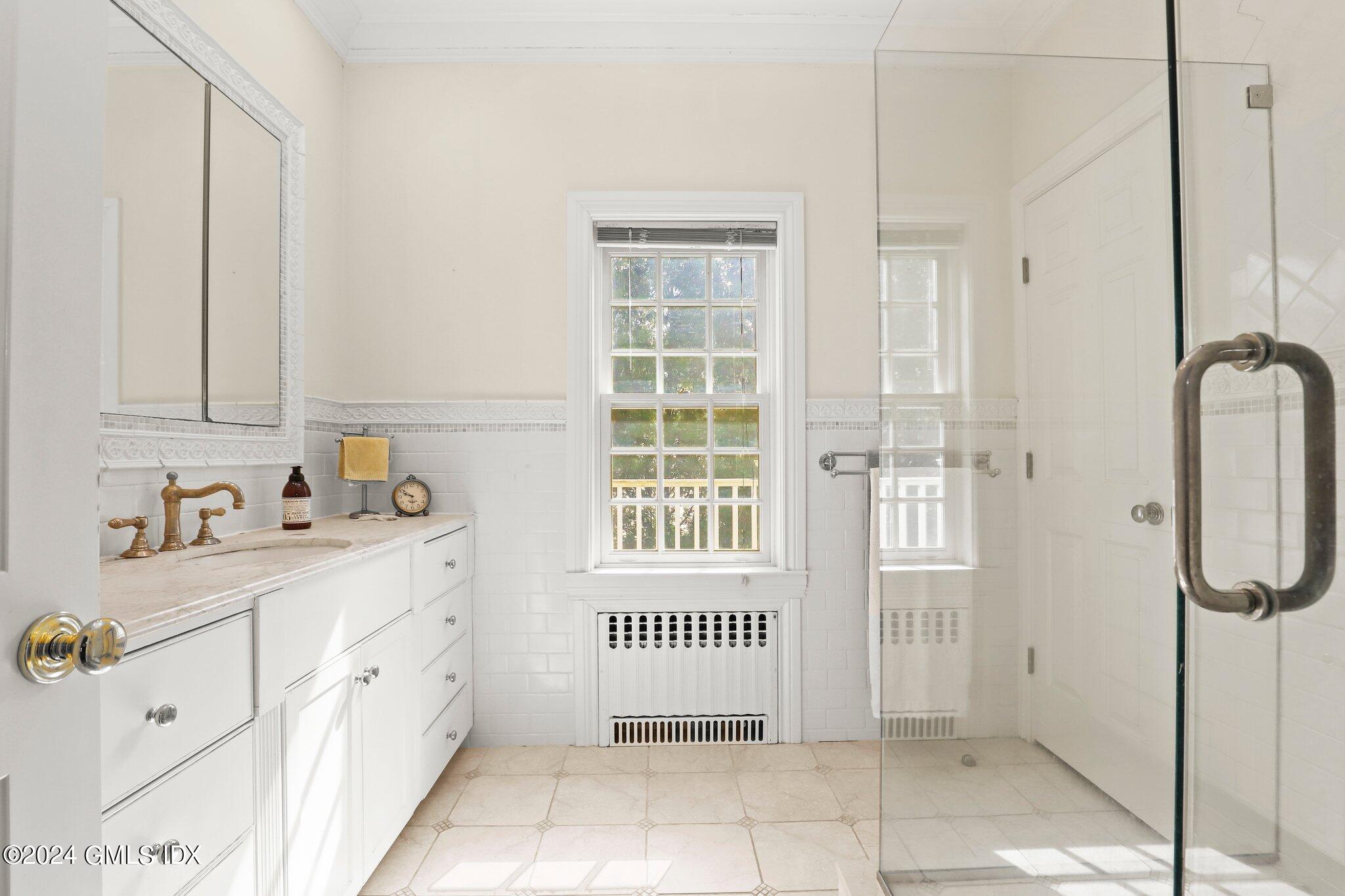 25 Field Road Riverside, CT 06878 - Photo 29 of 34 a bathroom with a window and a shower