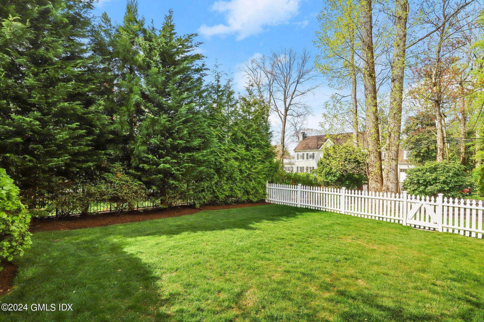 25 Field Road Riverside, CT 06878 - Photo 5 of 34 a view of a yard with a tree