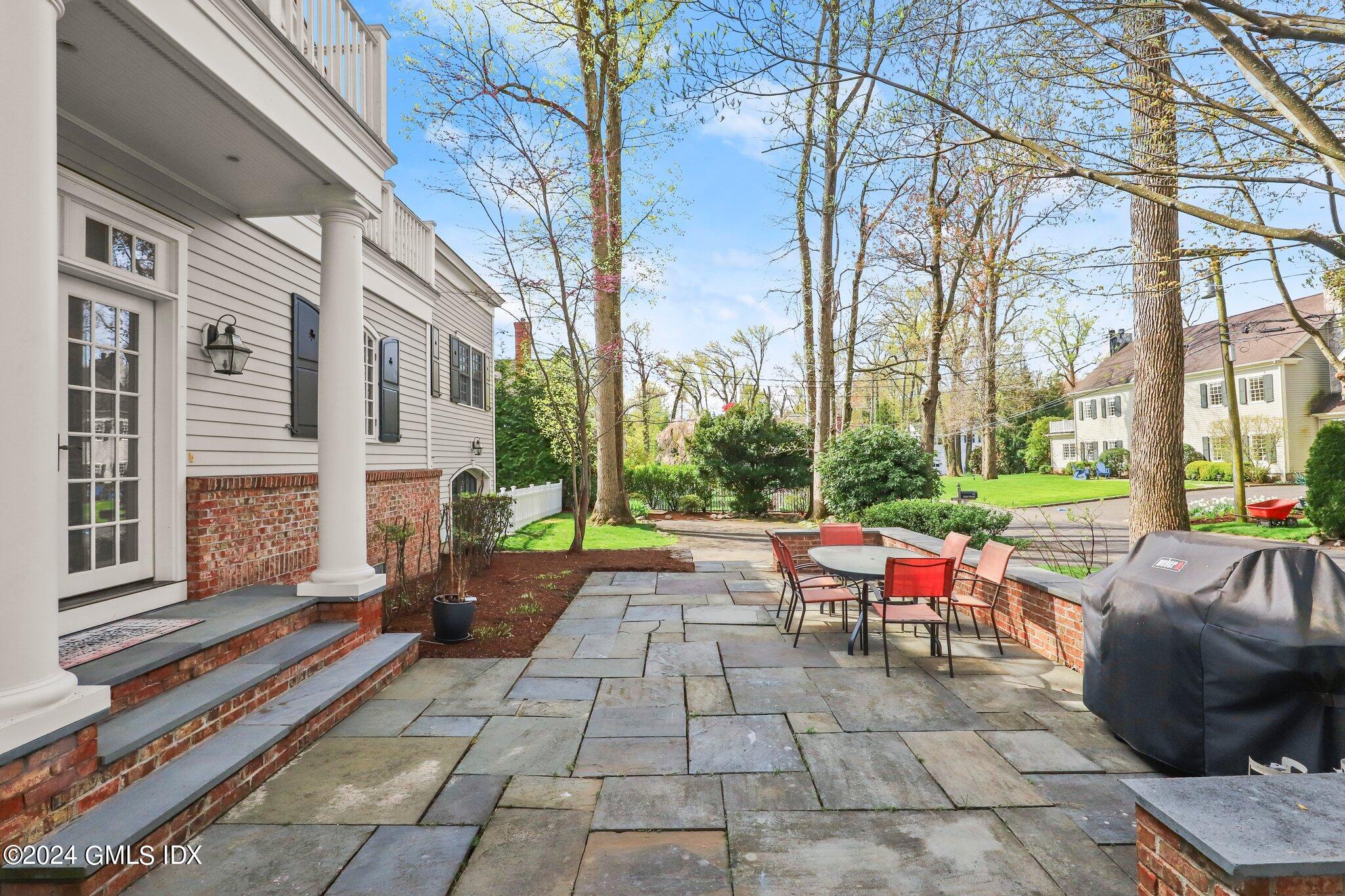 25 Field Road Riverside, CT 06878 - Photo 6 of 34 a patio with table and chairs and couches