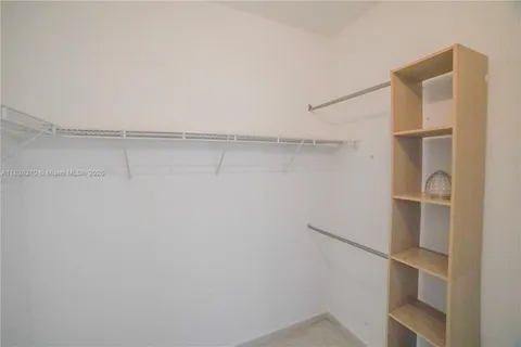 a view of an empty walk in closet