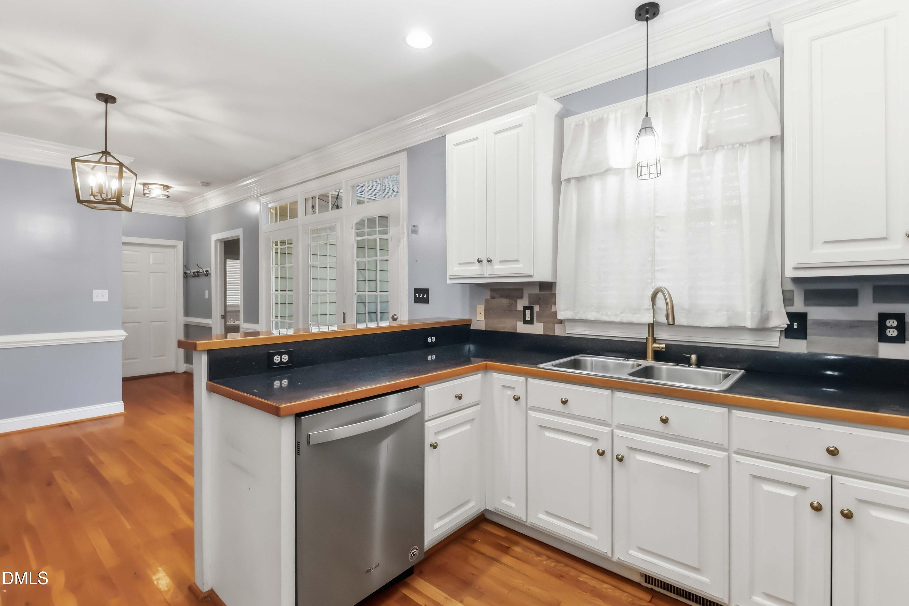 226 Fletcher Ridge Road Timberlake, NC 27583 - Photo 10 of 30 a kitchen with a sink and cabinets