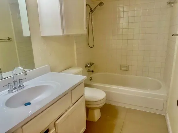 a bathroom with a sink a toilet and a bathtub