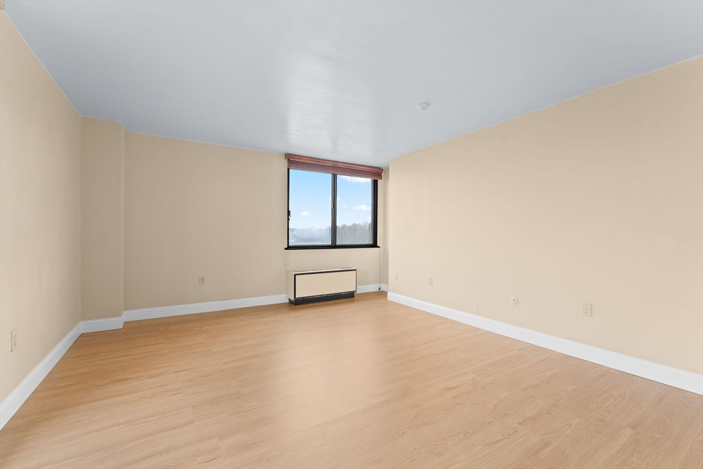 77 Adams Street, Unit 610 Quincy, MA 02169 - Photo 13 of 32 an empty room with windows