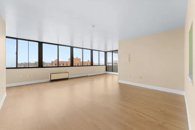 a view of an empty room with a window