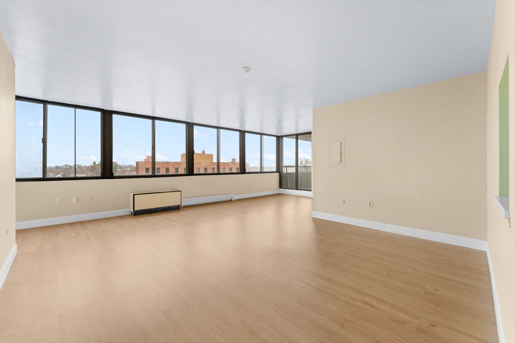 77 Adams Street, Unit 610 Quincy, MA 02169 - Photo 6 of 32 a view of an empty room with a window