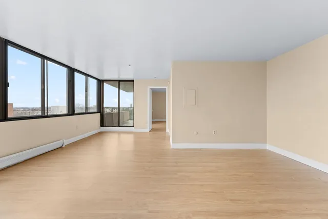 a view of an empty room with a window