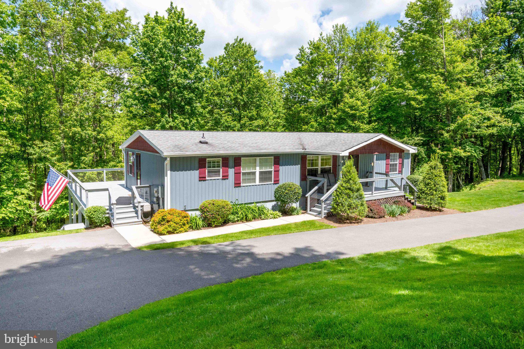 511 Hill Top Road Oakland, MD 21550 - Photo 3 of 51 Charming home nestled in lush greenery.
