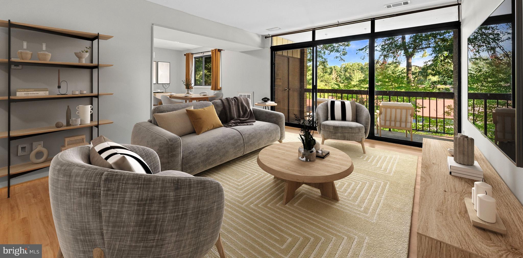 a living room with couches and a large window with outer view