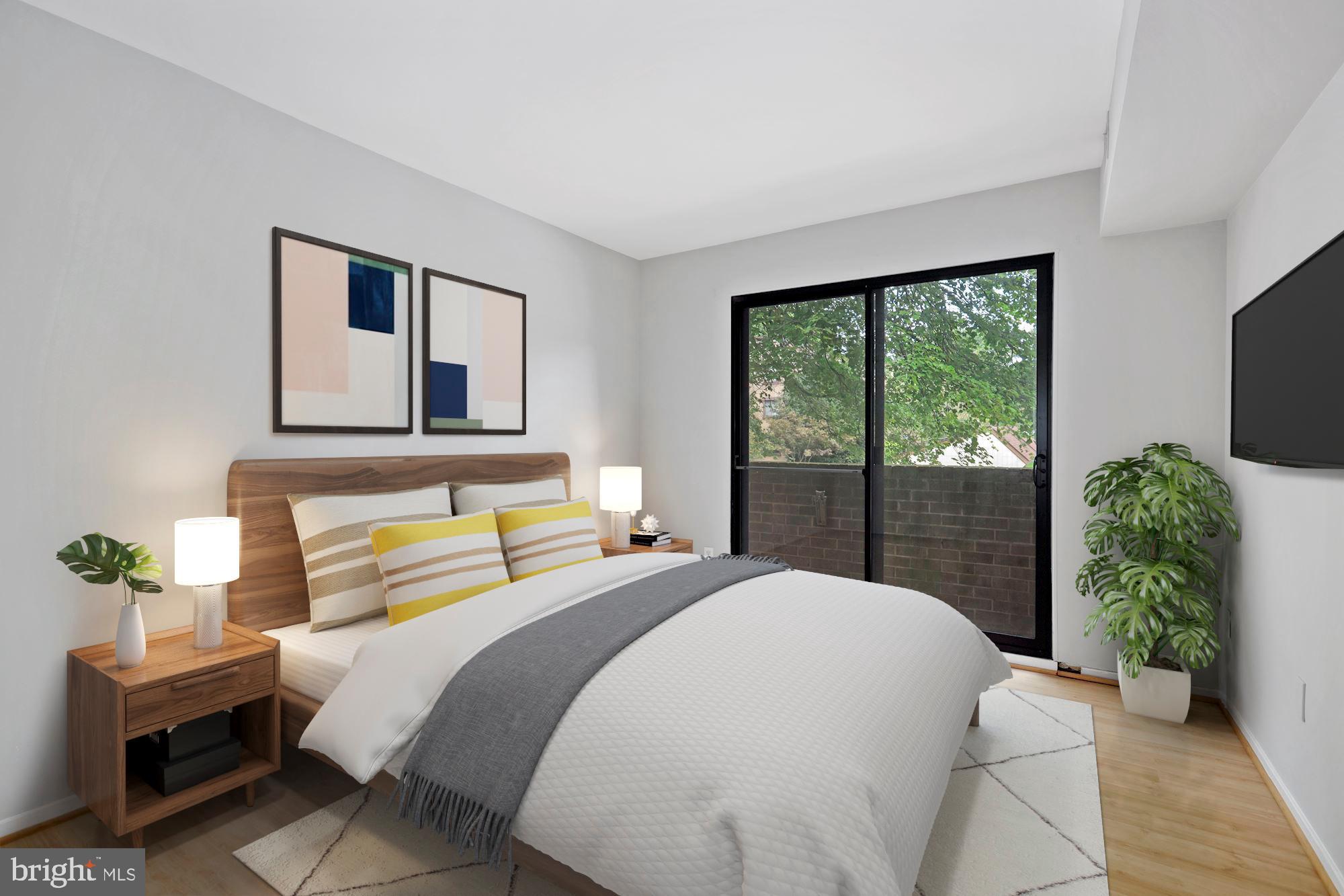 1645 Parkcrest Circle, Unit 200 Reston, VA 20190 - Photo 14 of 29 a bedroom with a bed table flowerpot and a window