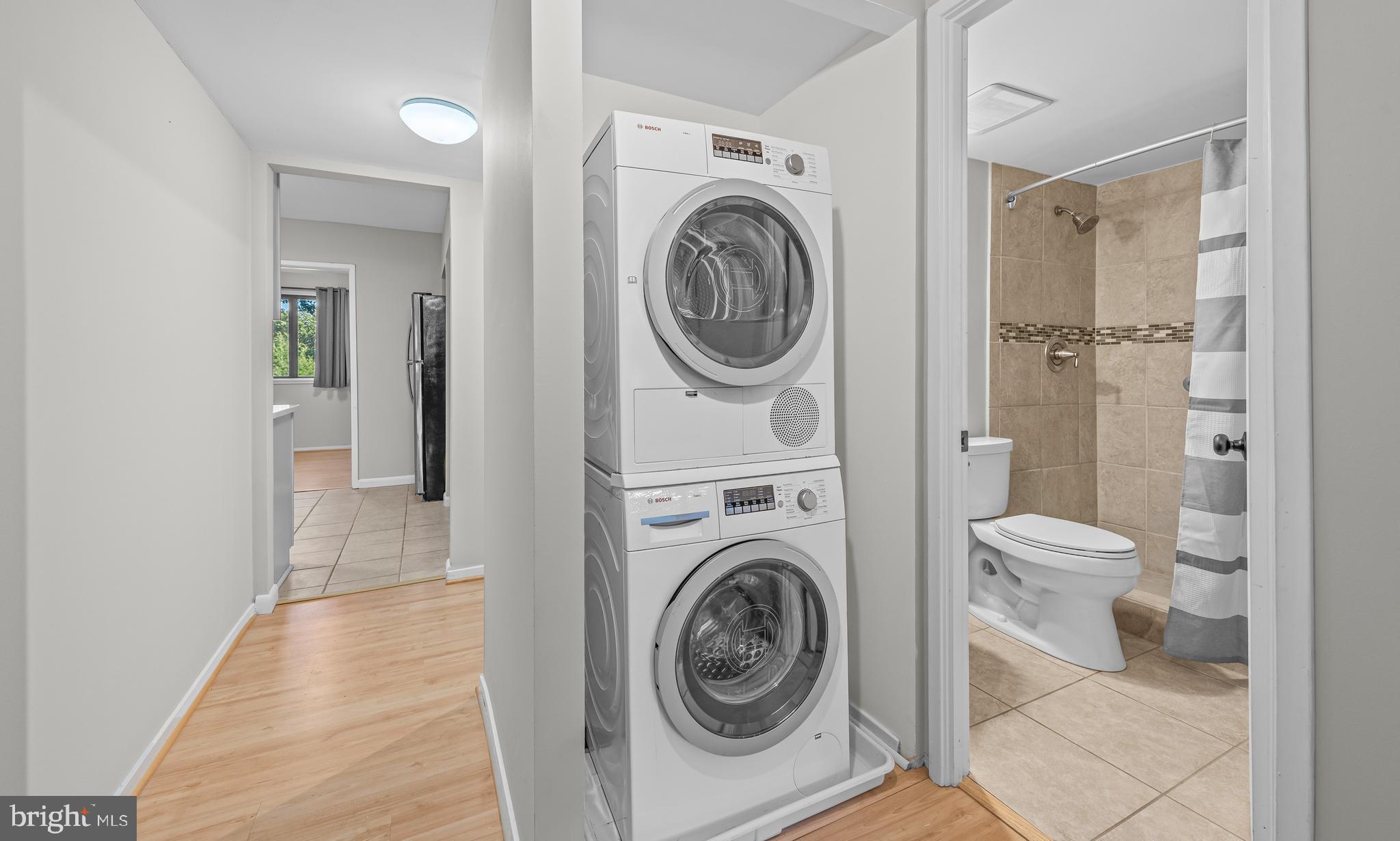 1645 Parkcrest Circle, Unit 200 Reston, VA 20190 - Photo 16 of 29 a view of a hallway with washer and dryer