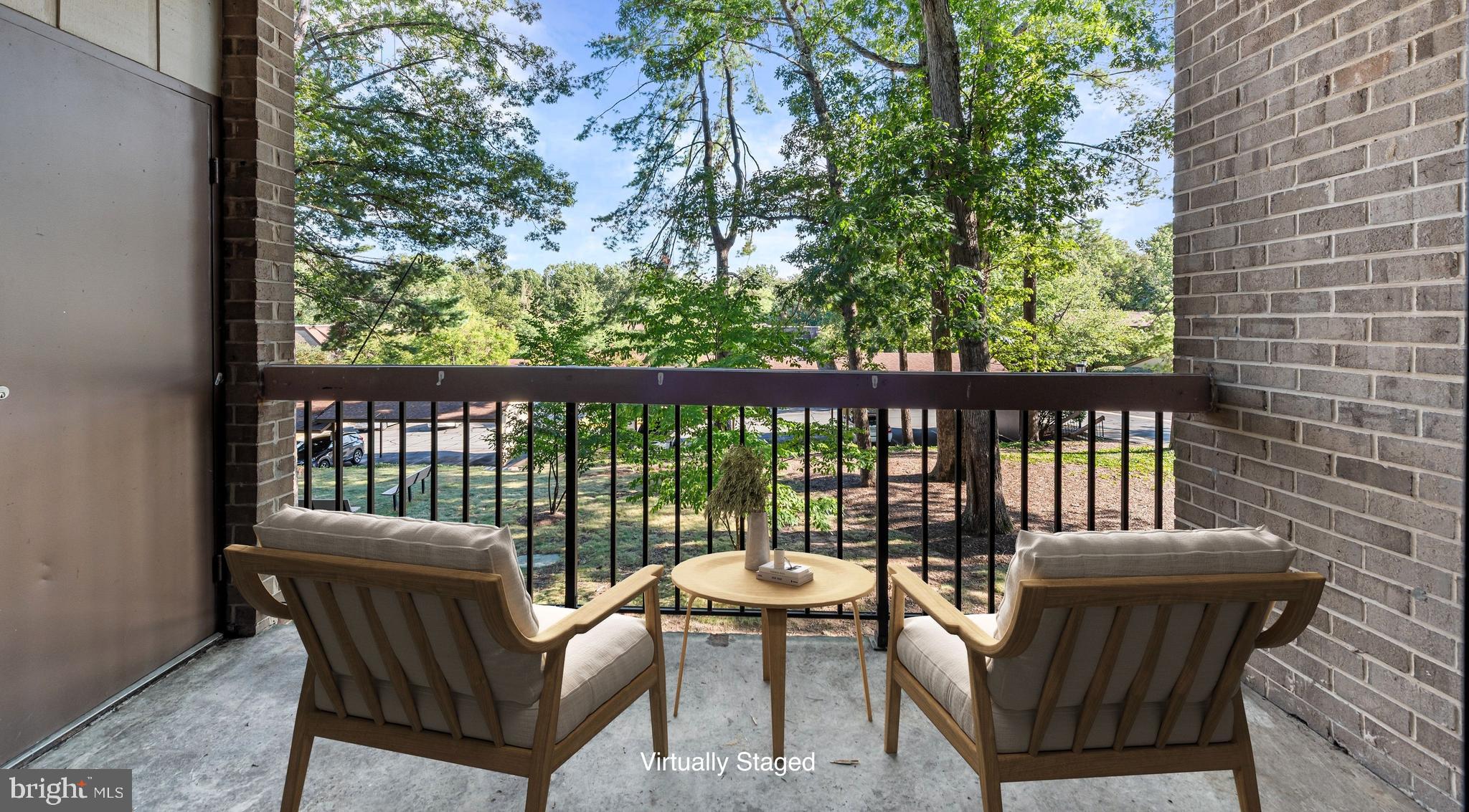 1645 Parkcrest Circle, Unit 200 Reston, VA 20190 - Photo 5 of 29 a view of a chair and table in the balcony