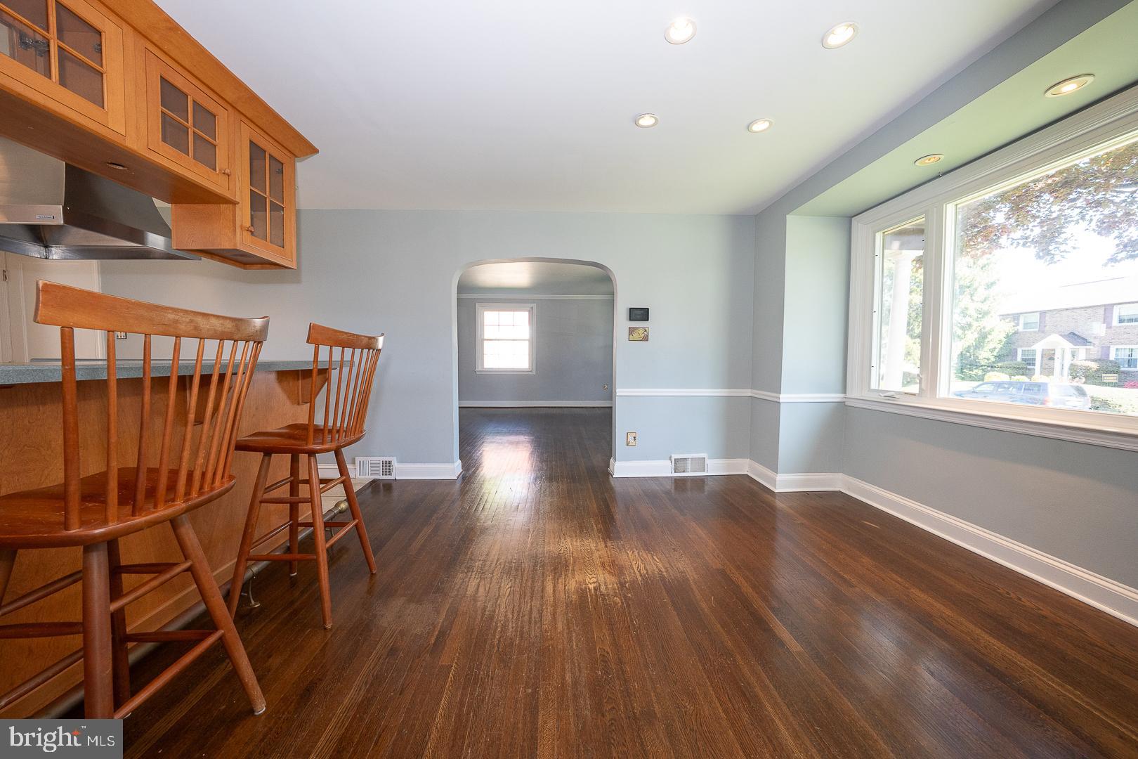 306 Sedgewood Road Springfield, PA 19064 - Photo 16 of 55 an empty room with wooden floor and windows