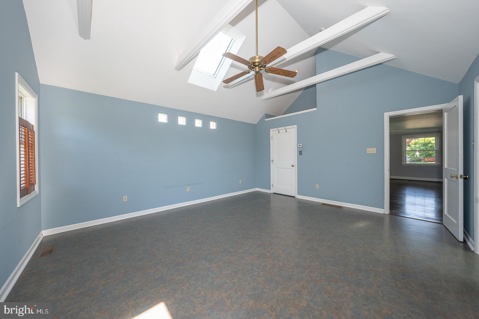 306 Sedgewood Road Springfield, PA 19064 - Photo 17 of 55 an empty room with wooden floor fan and windows