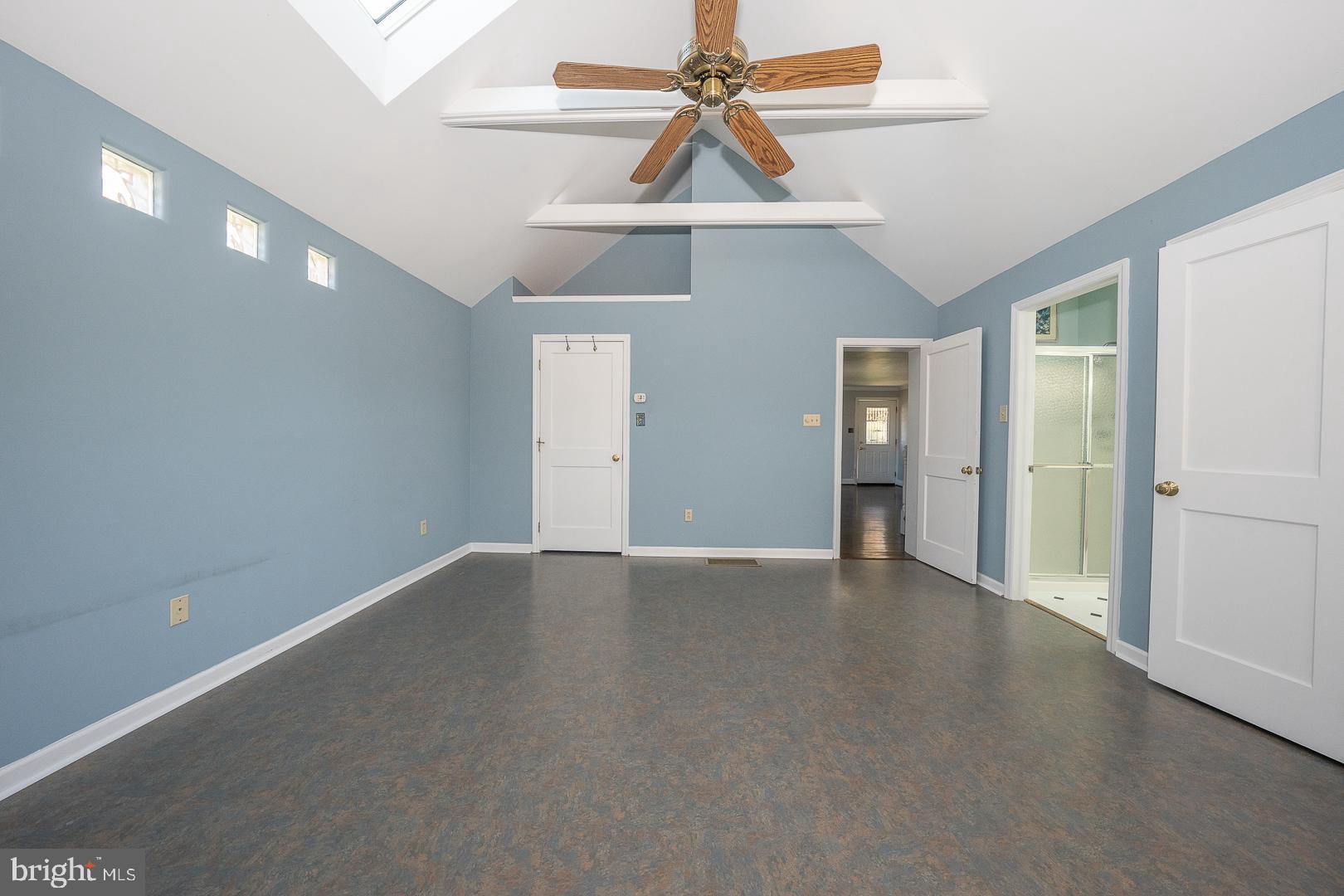 306 Sedgewood Road Springfield, PA 19064 - Photo 18 of 55 an empty room with chandelier fan and windows