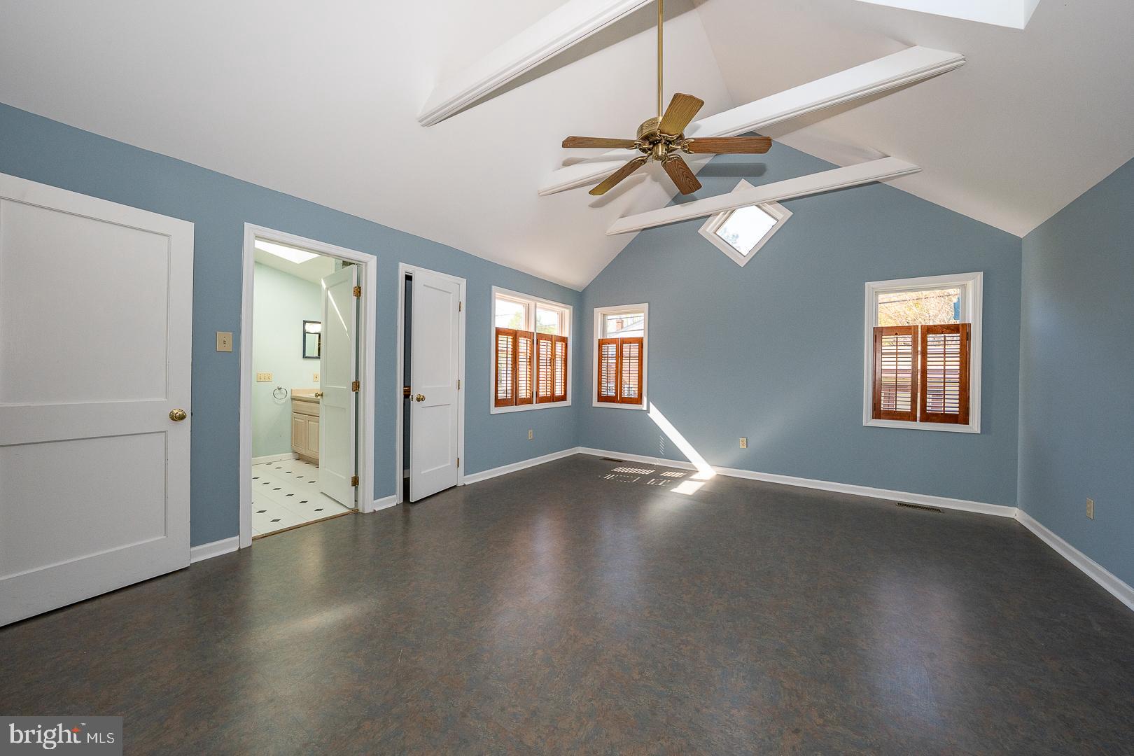 306 Sedgewood Road Springfield, PA 19064 - Photo 19 of 55 an empty room with wooden floor fan and windows