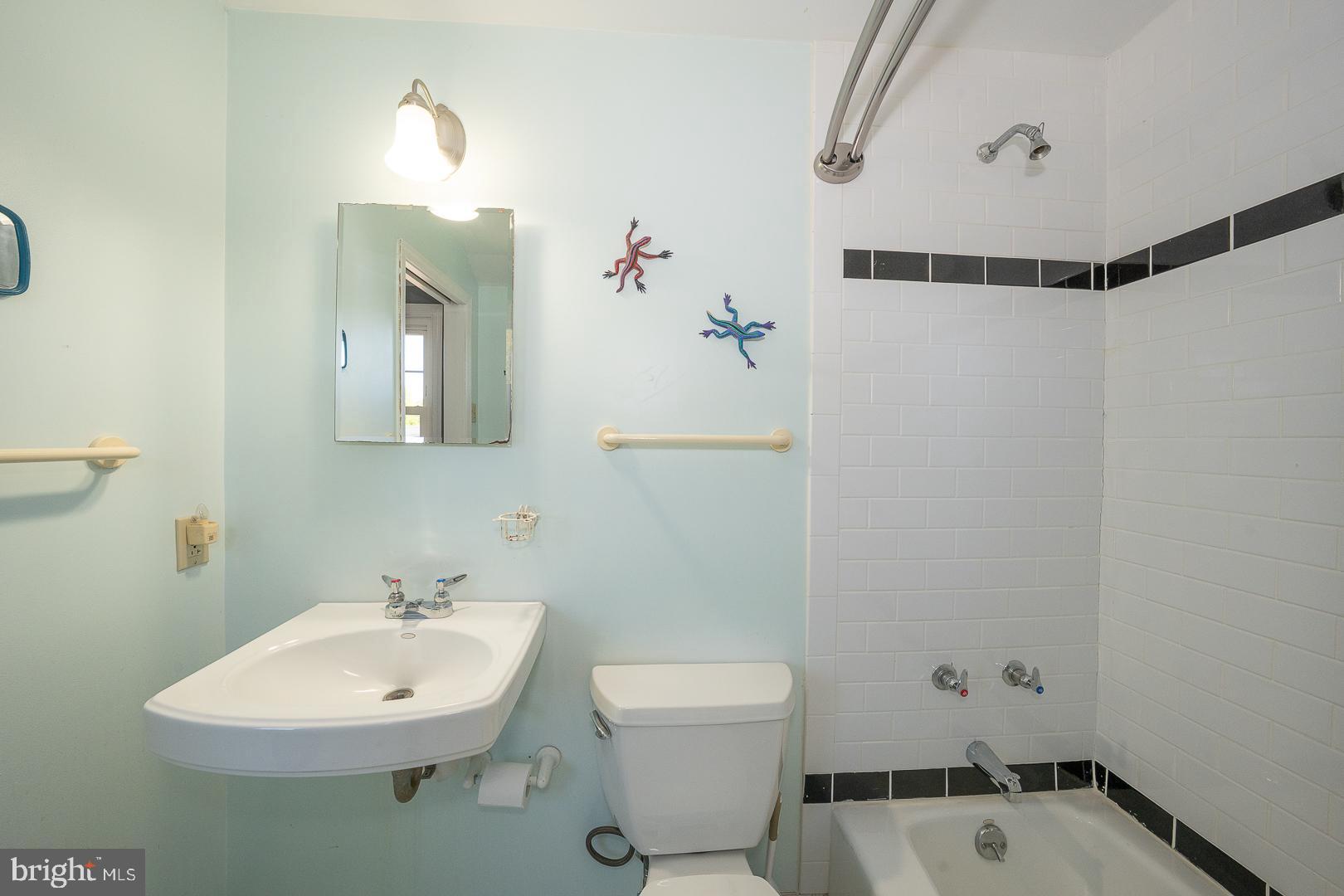 306 Sedgewood Road Springfield, PA 19064 - Photo 22 of 55 a bathroom with a sink toilet and mirror