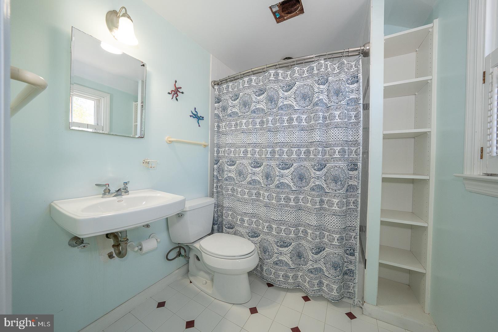 306 Sedgewood Road Springfield, PA 19064 - Photo 24 of 55 a bathroom with a sink a toilet and shower