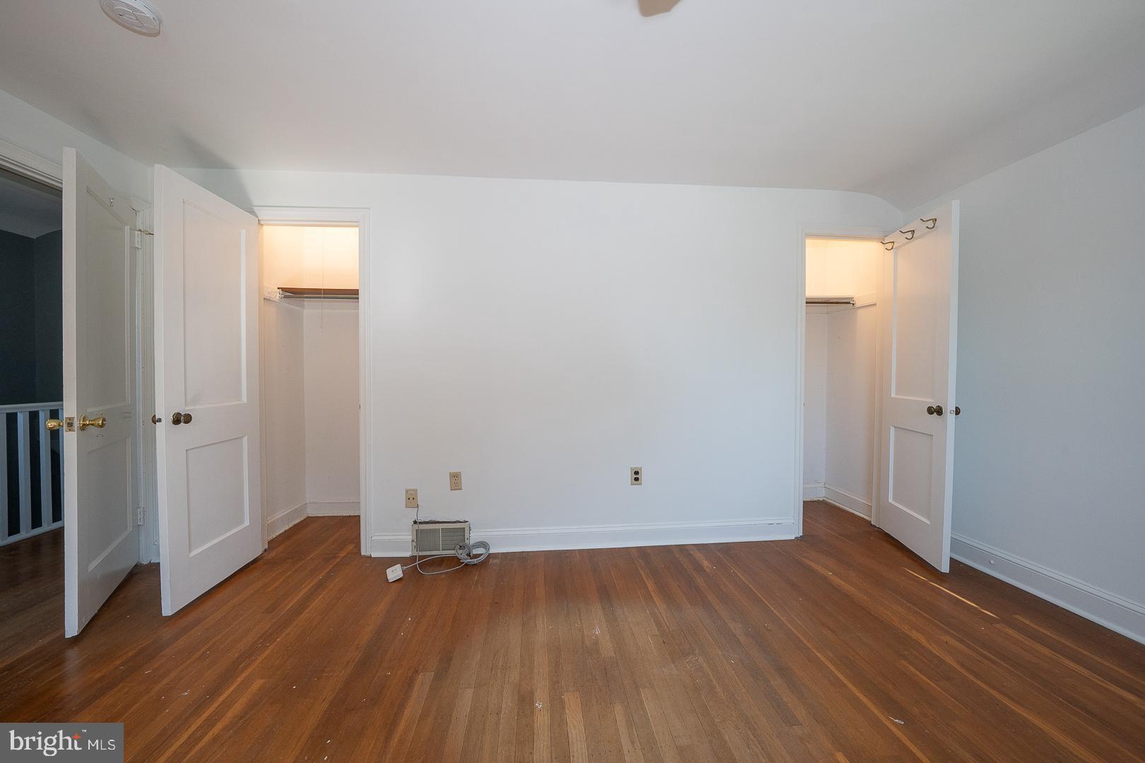 306 Sedgewood Road Springfield, PA 19064 - Photo 25 of 55 an empty room with wooden floor and a window