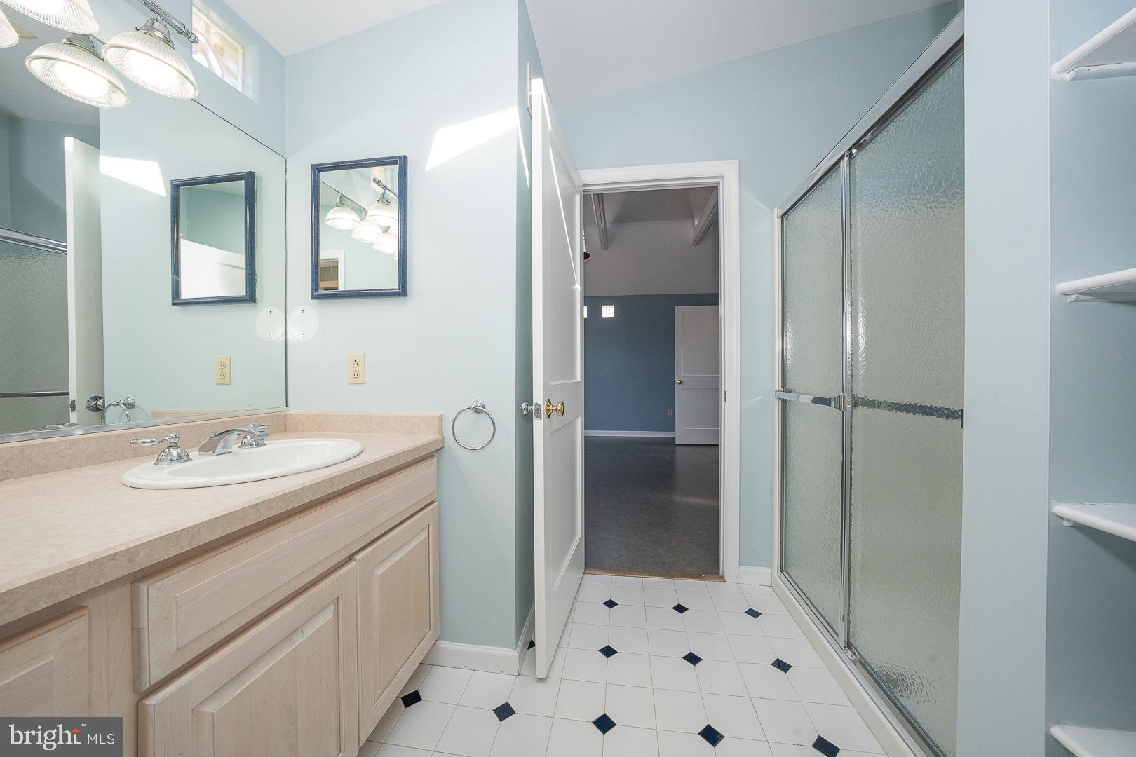306 Sedgewood Road Springfield, PA 19064 - Photo 29 of 55 a bathroom with a sink and a mirror