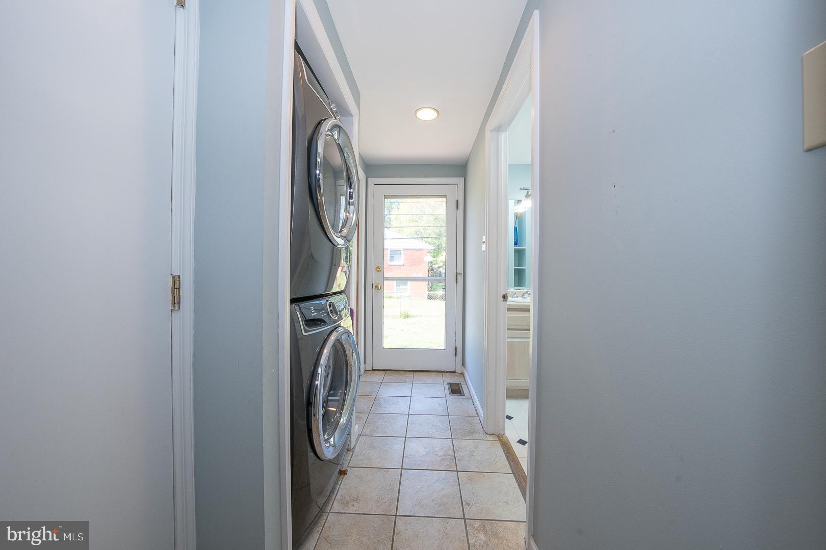 306 Sedgewood Road Springfield, PA 19064 - Photo 30 of 55 a view of a hallway with washer and dryer