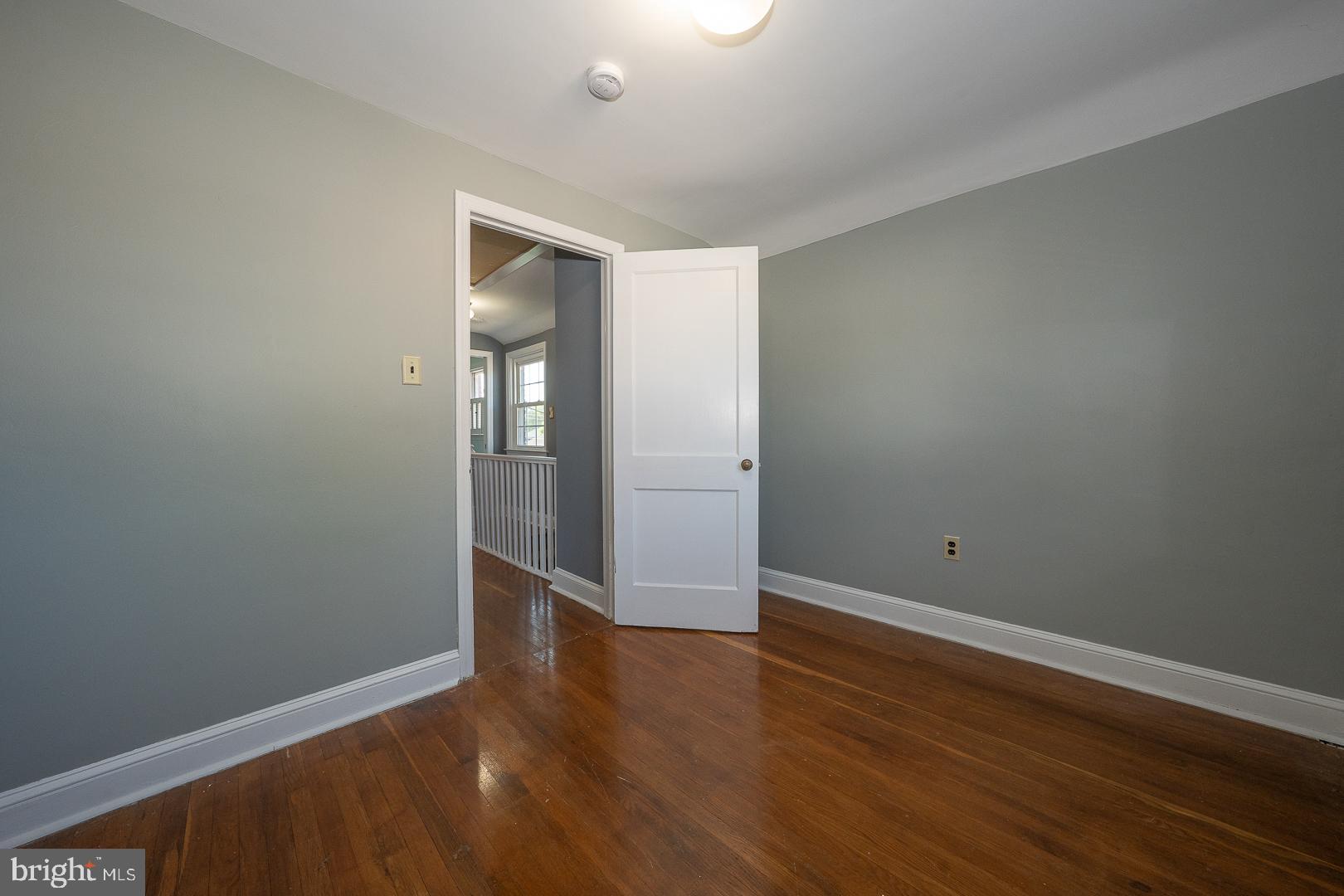 306 Sedgewood Road Springfield, PA 19064 - Photo 33 of 55 a view of an empty room with wooden floor and closet