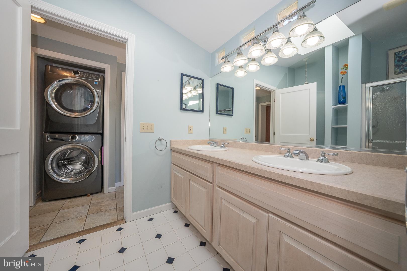 306 Sedgewood Road Springfield, PA 19064 - Photo 37 of 55 a bathroom with a sink a vanity and a mirror