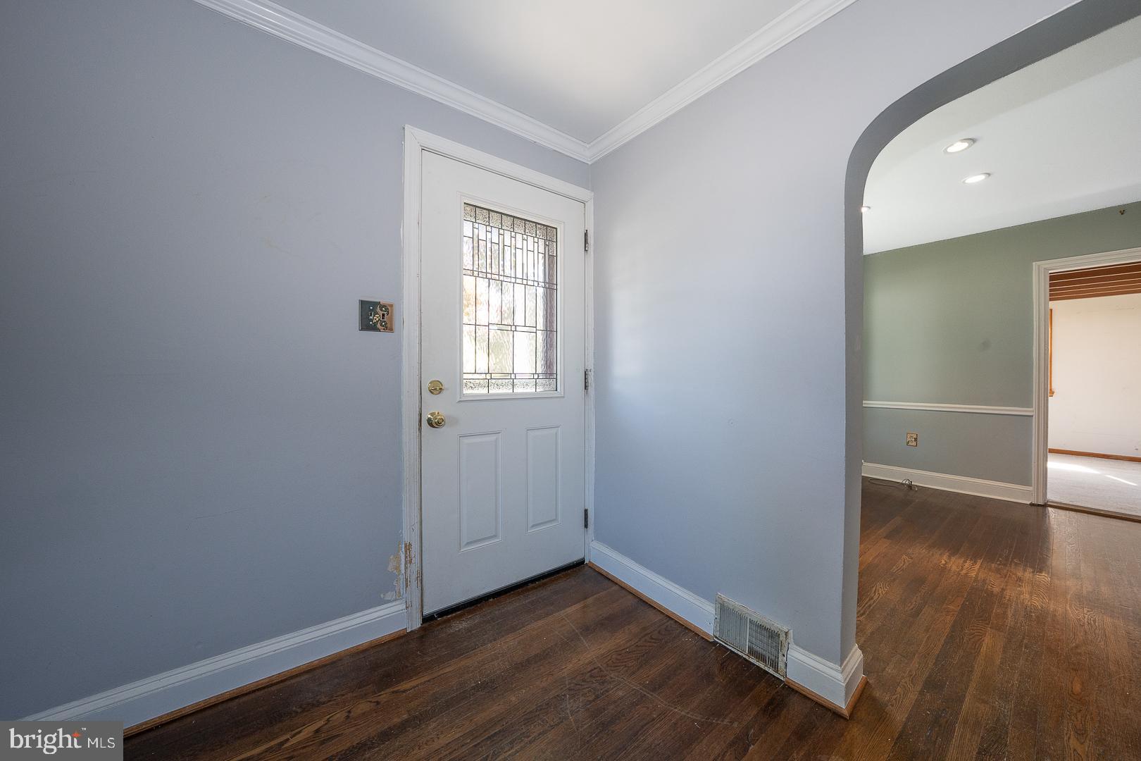 306 Sedgewood Road Springfield, PA 19064 - Photo 4 of 55 an empty room with wooden floor and windows