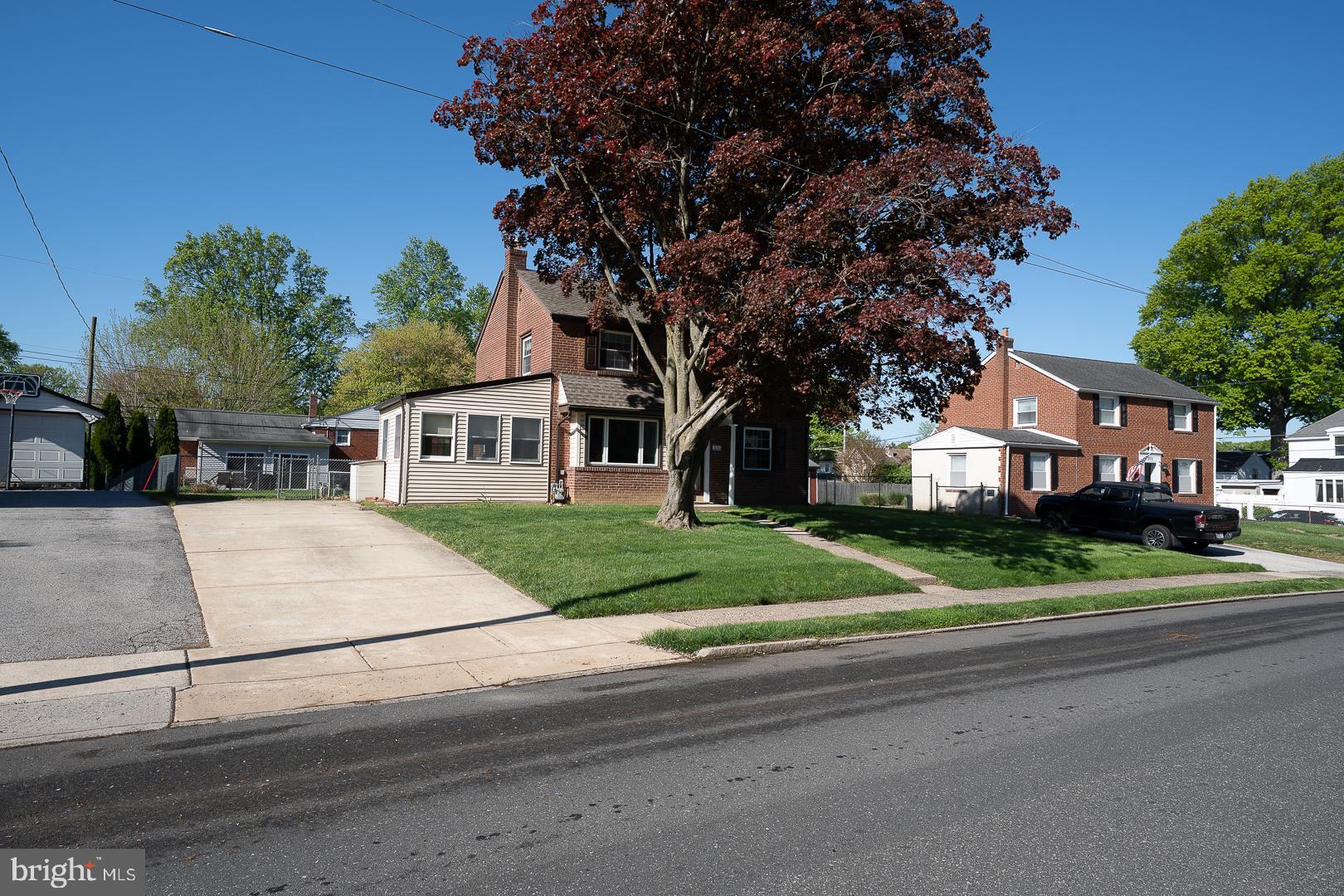 306 Sedgewood Road Springfield, PA 19064 - Photo 51 of 55 a white house that has a tree in front of it