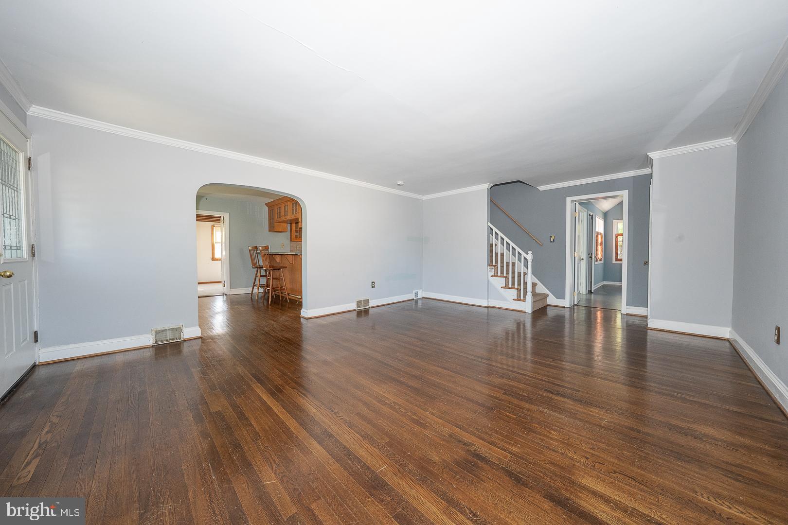 306 Sedgewood Road Springfield, PA 19064 - Photo 7 of 55 an empty room with wooden floor and windows