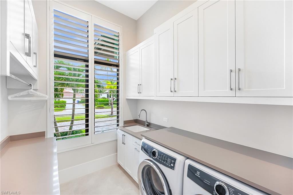 4646 Crayton Road Naples, FL 34103 - Photo 18 of 26 a utility room with dryer and washer