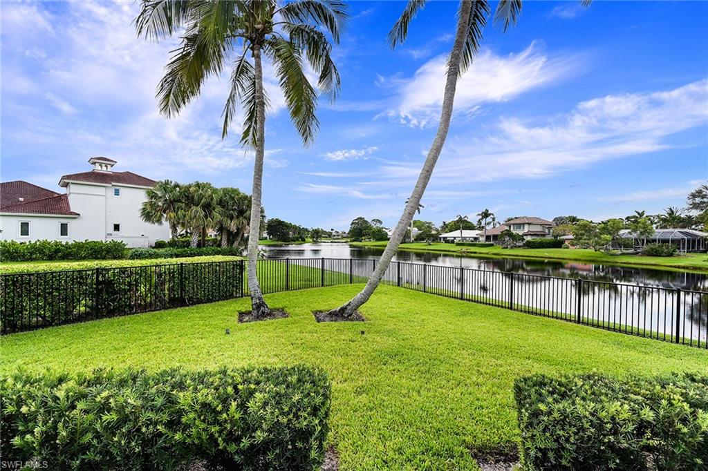 4646 Crayton Road Naples, FL 34103 - Photo 24 of 26 a view of a garden with swimming pool