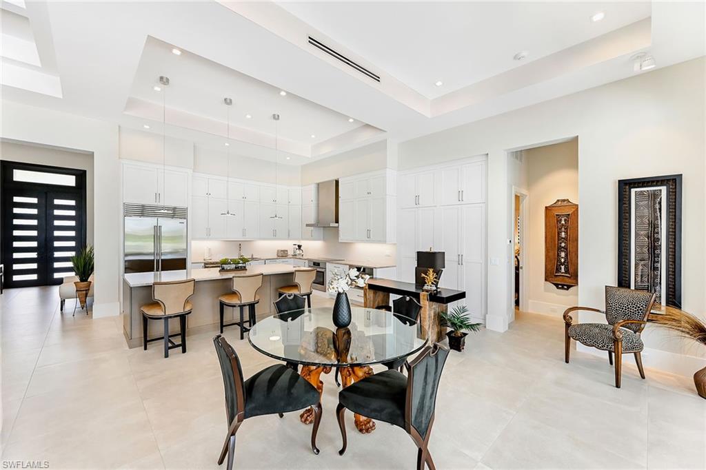 4646 Crayton Road Naples, FL 34103 - Photo 4 of 26 a view of a dining room with furniture
