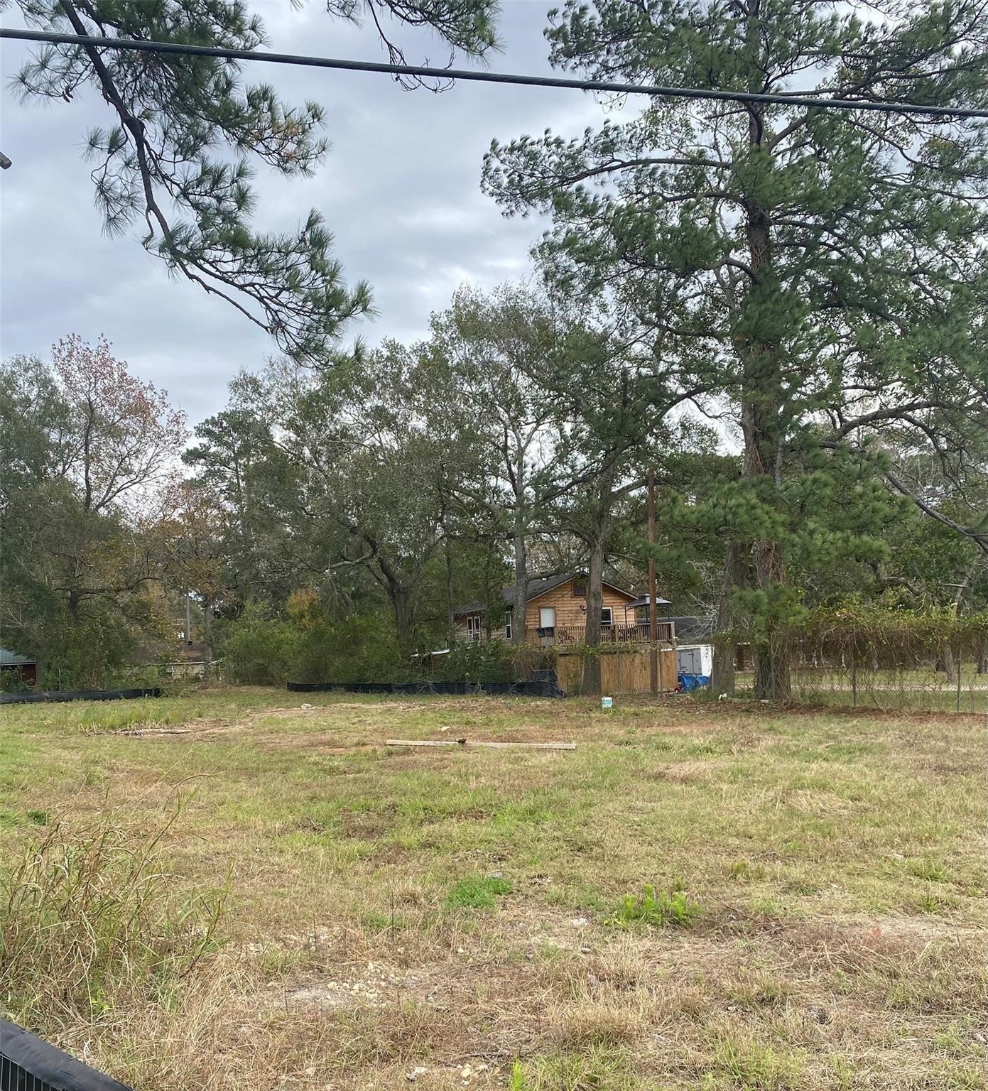 1304-1306 North Frazier Street Conroe, TX 77301 - Photo 2 of 8 a backyard of a house with lots of green space
