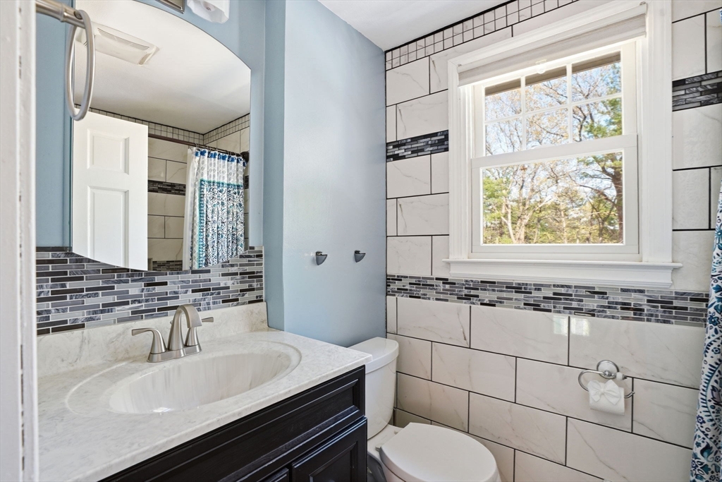 3 Fairway Drive Canton, MA 02021 - Photo 21 of 34 a bathroom with a sink and a toilet