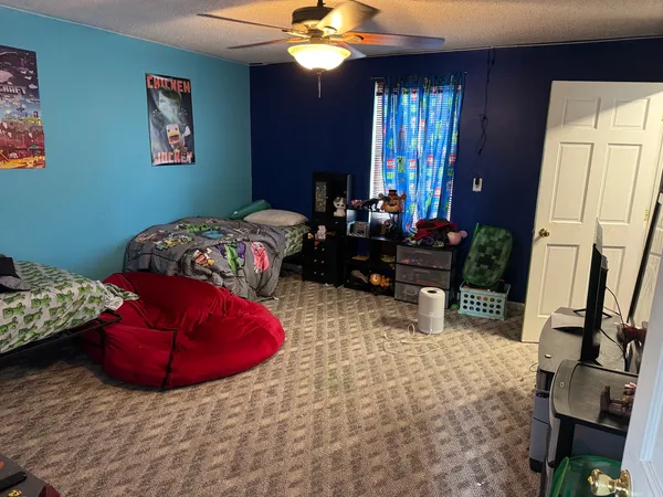 a bedroom with furniture and a bed