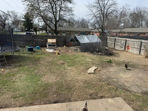 a front view of a house with a garden and patio