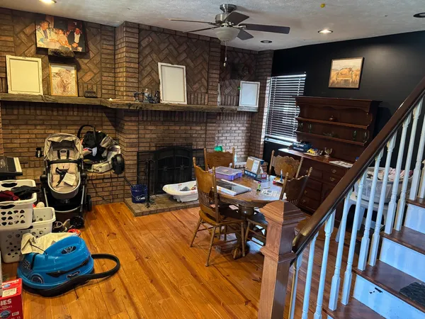 a dining room with furniture and a fireplace
