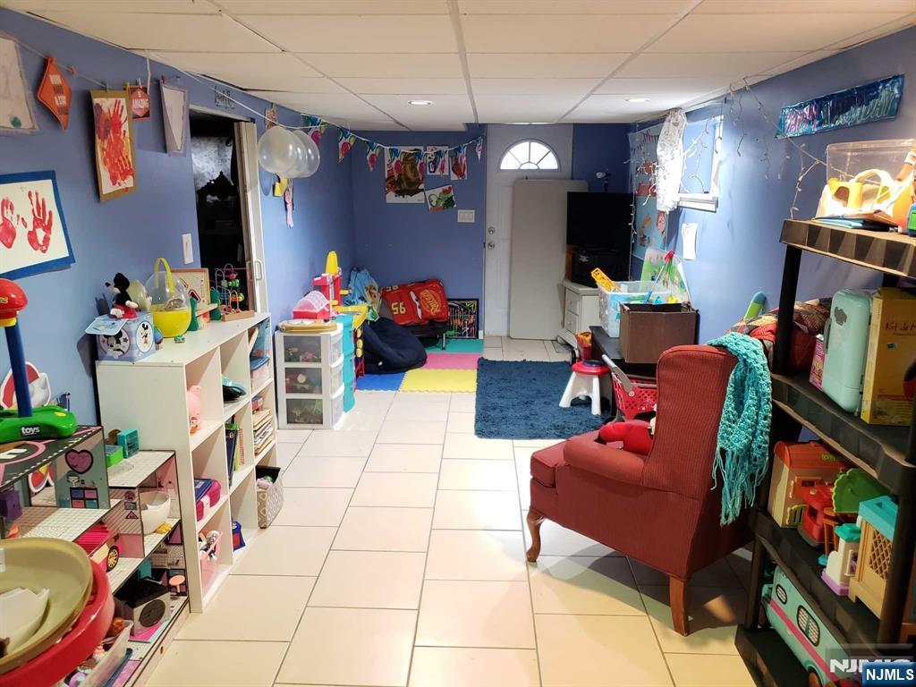 39 Tuttle Street Wallington, NJ 07057 - Photo 21 of 30 a living room with furniture and a flat screen tv