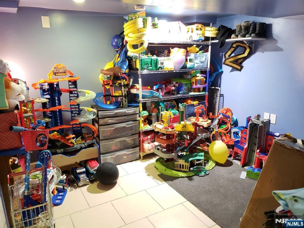 39 Tuttle Street Wallington, NJ 07057 - Photo 22 of 30 a store room filled with lots of different kinds of flowers